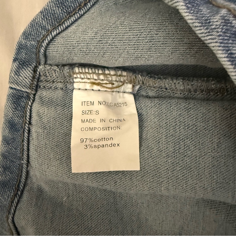 Light blue denim vest with buckle details on the sides - Picture 8 of 8